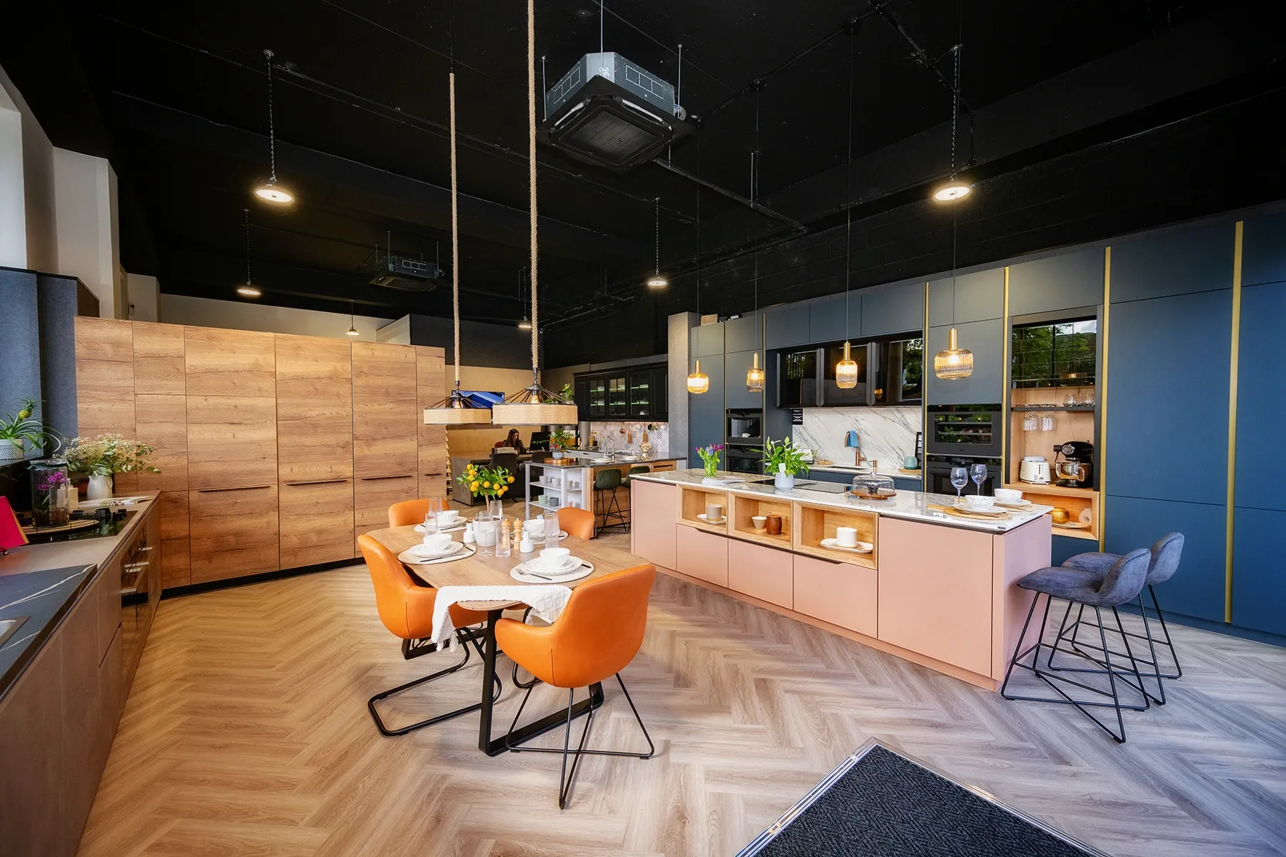 Modern kitchen with blue and coral cupboards